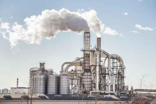 Industrial chemical plant with silos and process piping